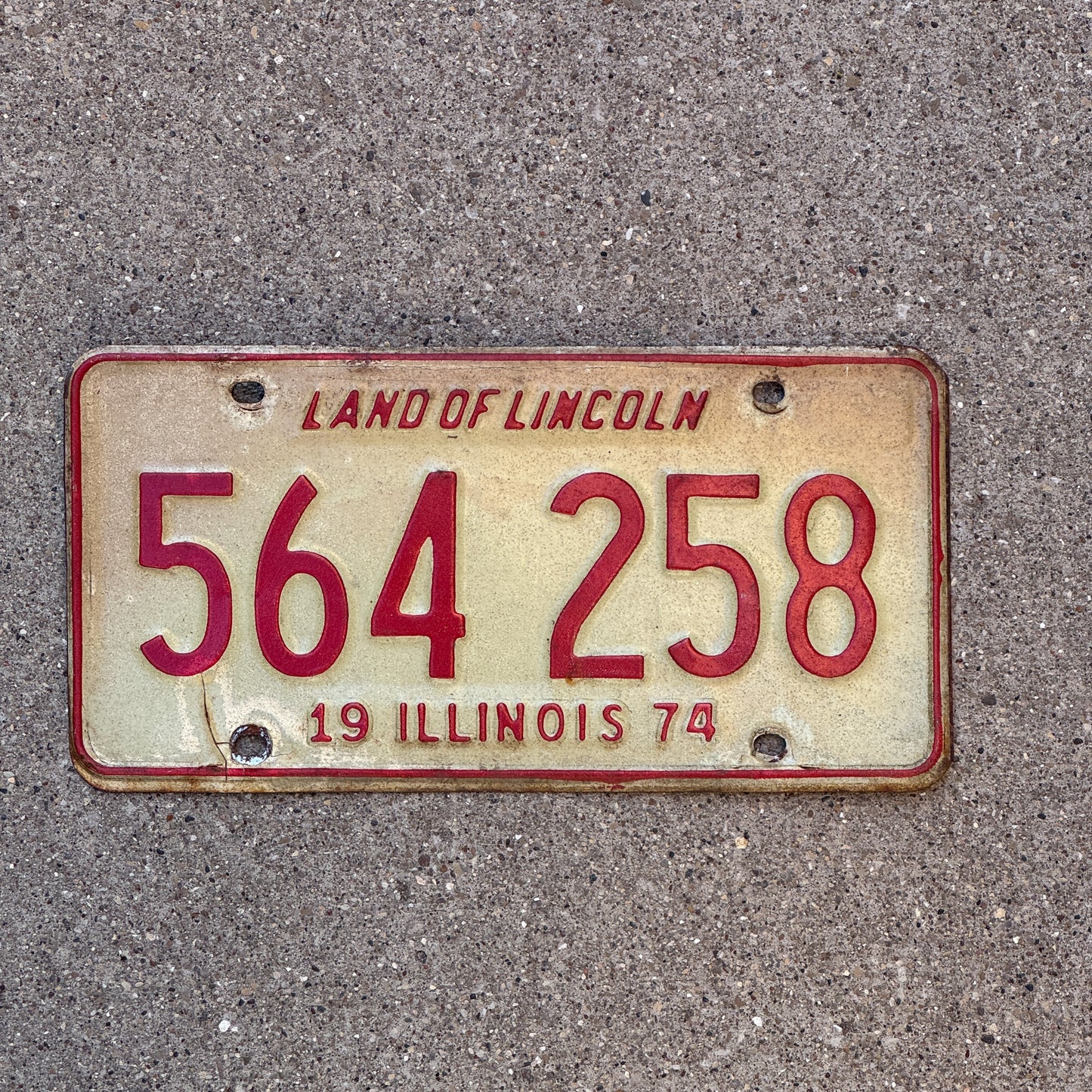 Photo of a 1974 Illinois License Plate Auto Tag Garage Decor Vintage 564 258 with original patina