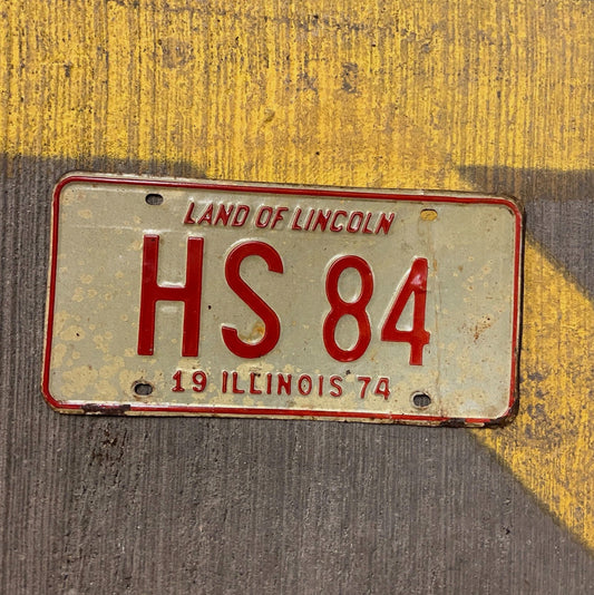 Photo of a 1974 Illinois License Plate Auto Tag Garage Decor Vintage HS 84 with original patina