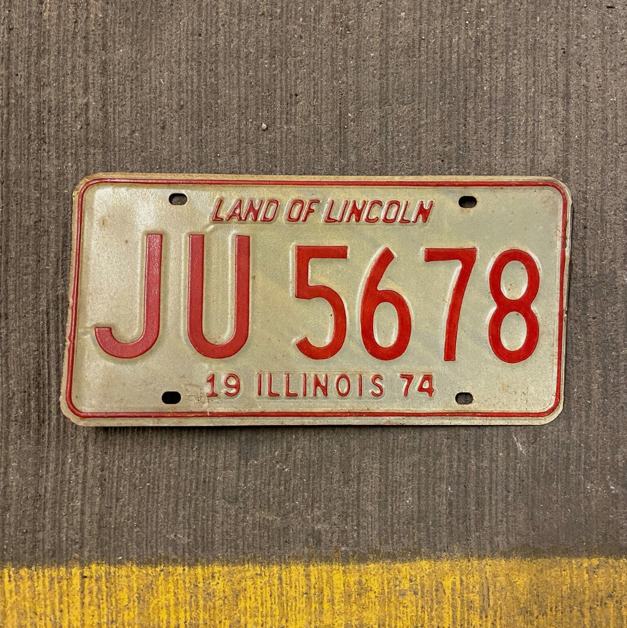Photo of a 1974 Illinois License Plate Auto Tag Garage Decor Vintage JU 5678 with original patina