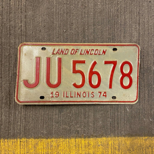 Photo of a 1974 Illinois License Plate Auto Tag Garage Decor Vintage JU 5678 with original patina