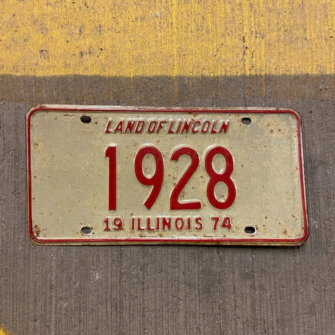 Photo of a 1974 Illinois License Plate Auto Tag Garage Decor Vintage Low Number Four Digit 1928 with original patina