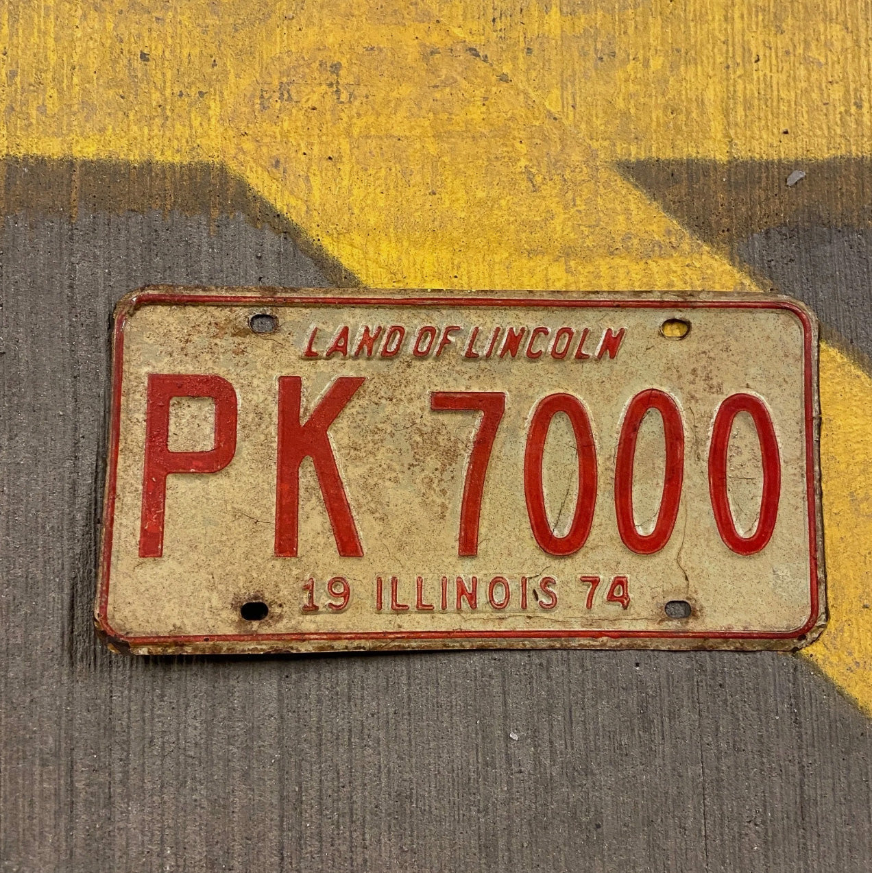 Photo of a 1974 Illinois License Plate Auto Tag Garage Decor Vintage Nice Number PK 7000 with original patina