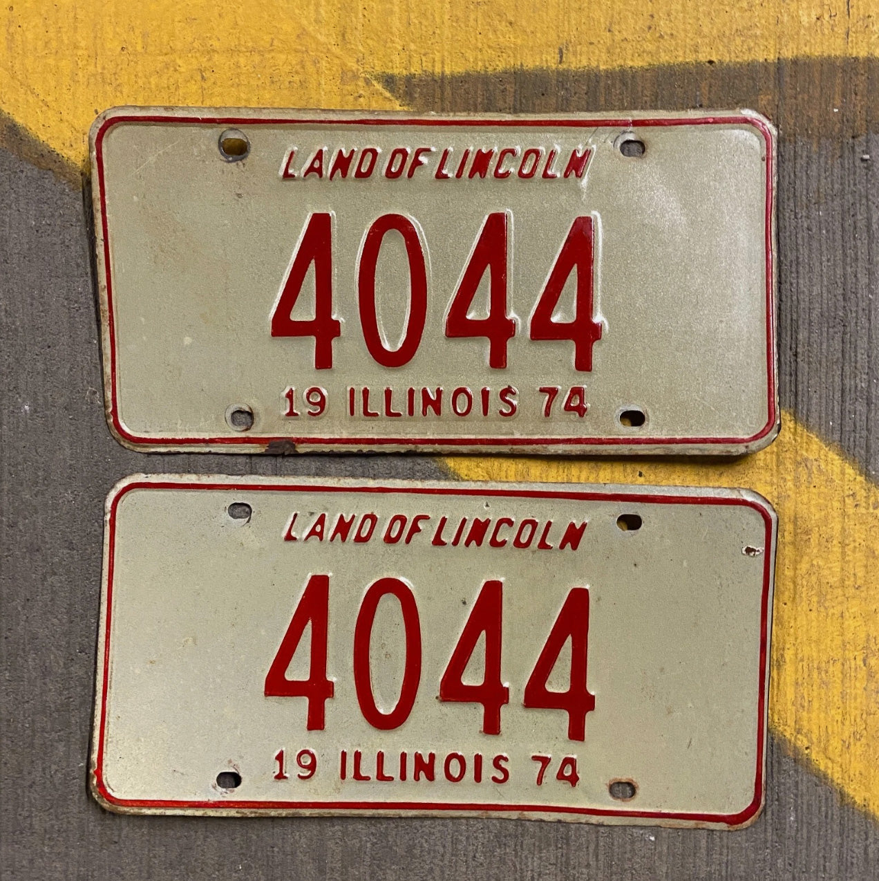 Photo of a 1974 Illinois License Plate Pair Auto Tag Garage Decor Vintage Low Number Four Digit 4044 with original patina