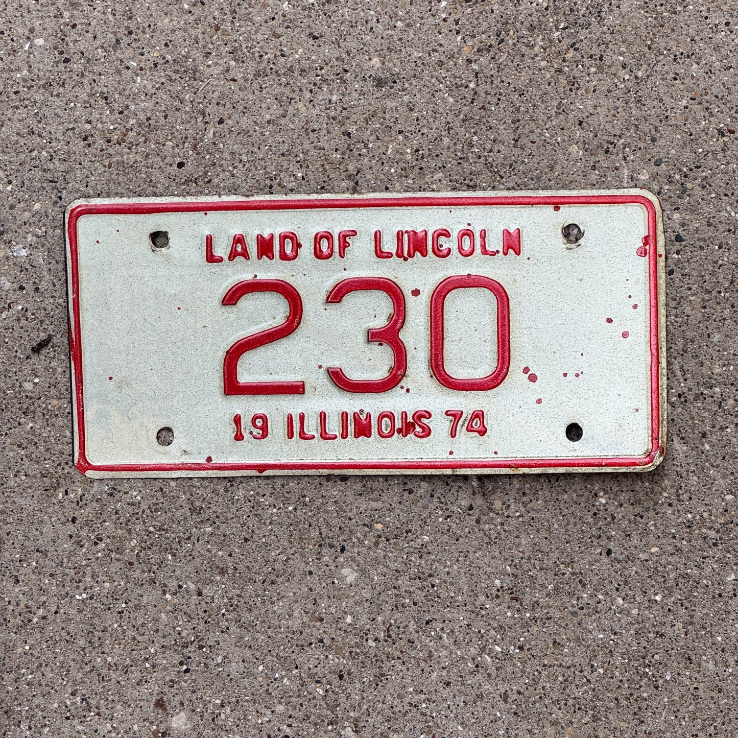 Photo of a 1974 Illinois Motorcycle License Plate Auto Tag Garage Decor Vintage Low Number Three Digit 230 with original patina