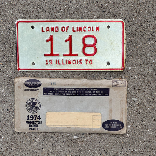 Photo of a 1974 Illinois Motorcycle License Plate Auto Tag Garage Decor Vintage Low Number Three Digit with Envelope 118 with original patina