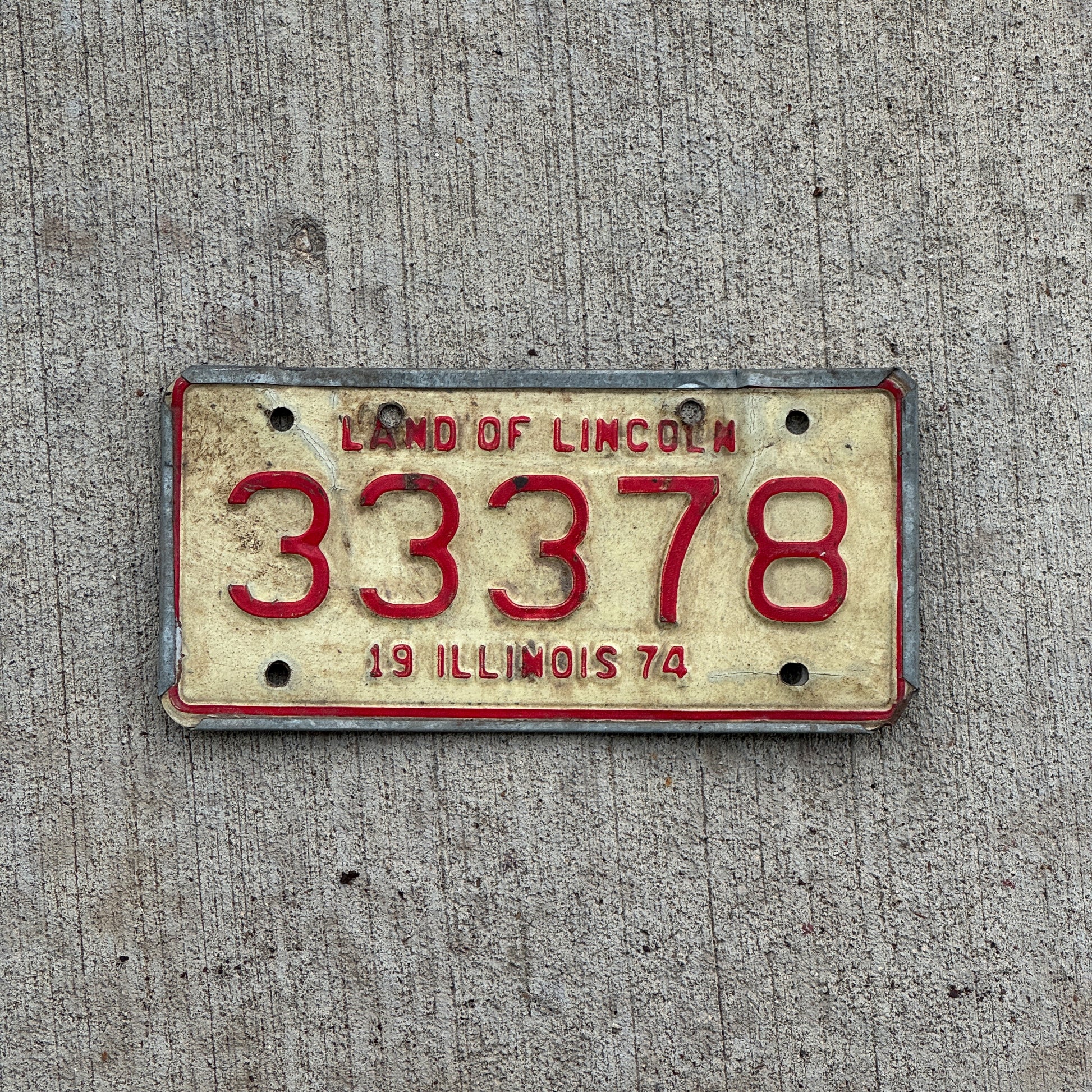 Photo of a 1974 Illinois Motorcycle License Plate Auto Tag Garage Decor Vintage Repeat Repeating 33378 with original patina