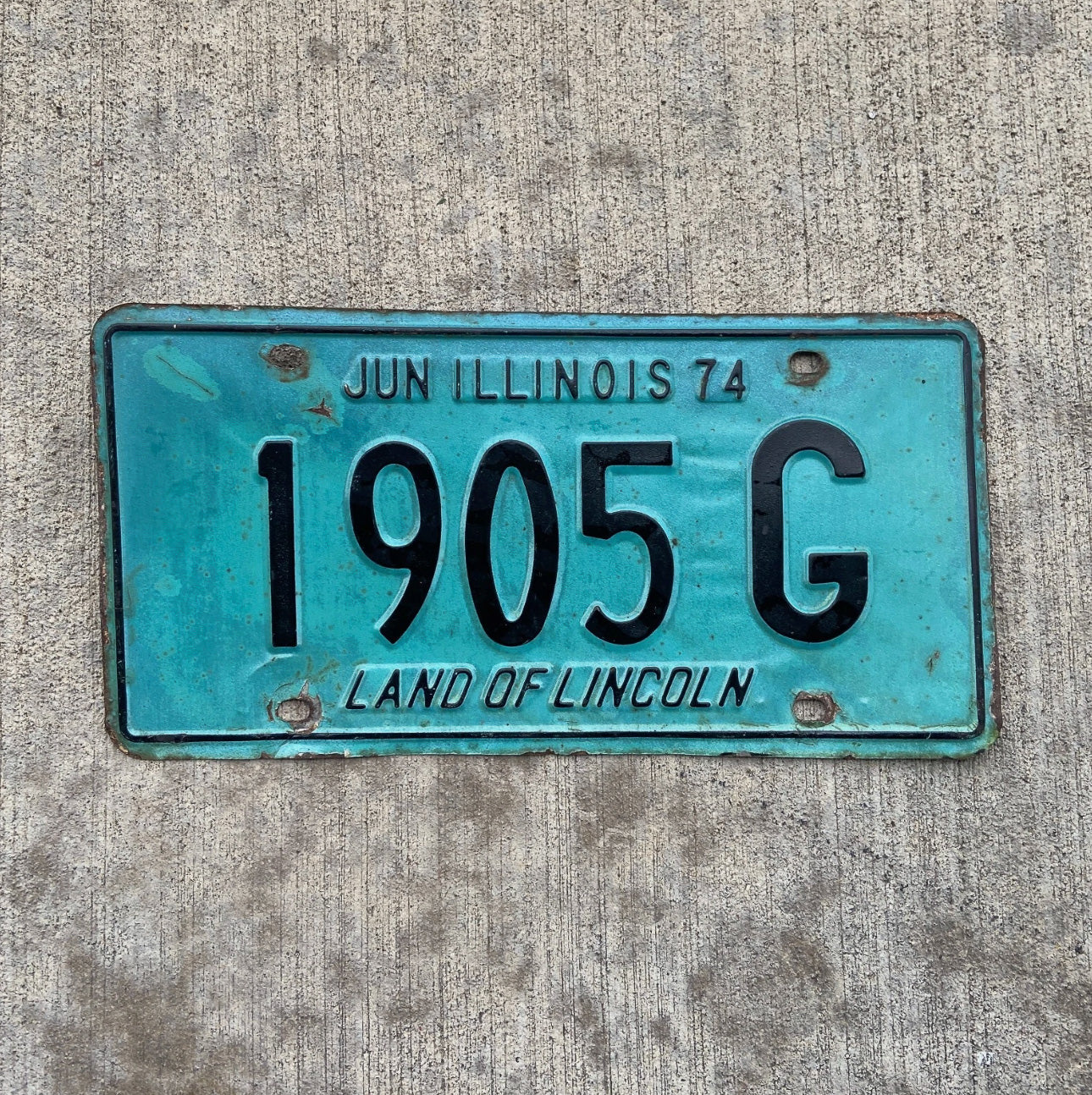 Photo of a 1974 Illinois Truck License Plate Auto Tag Garage Decor Vintage 1905 G with original patina