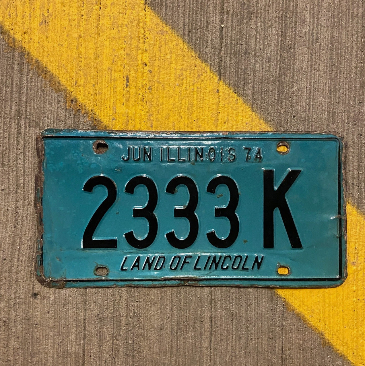 Photo of a 1974 Illinois Truck License Plate Auto Tag Garage Decor Vintage Repeat Repeating 2333 K with original patina