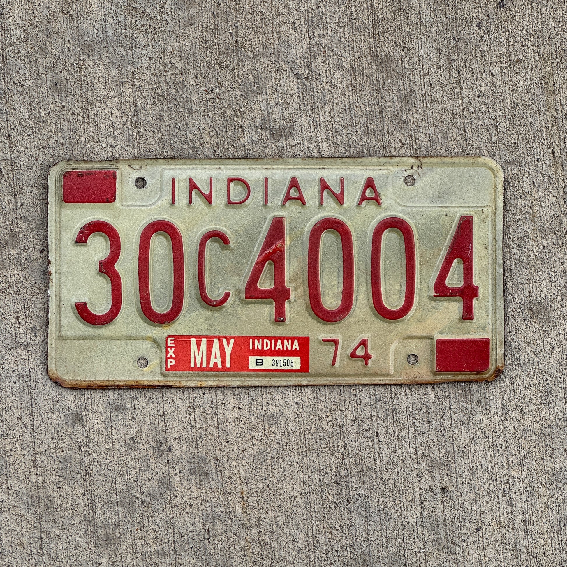 Photo of a 1974 Indiana License Plate Auto Tag Garage Decor Vintage 30 C 4004 with original patina