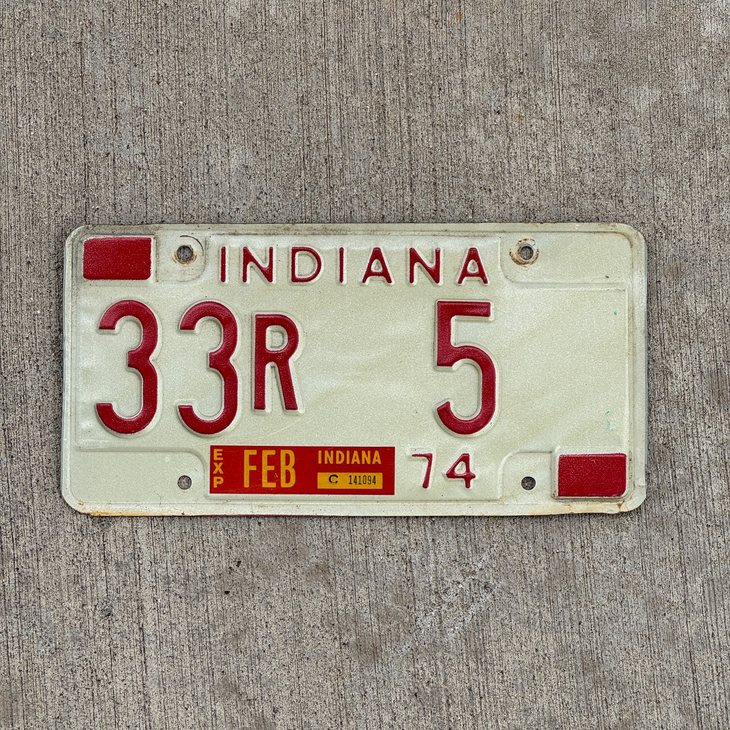 Photo of a 1974 Indiana License Plate Auto Tag Garage Decor Vintage Henry County Low Number 33 R 5 with original patina