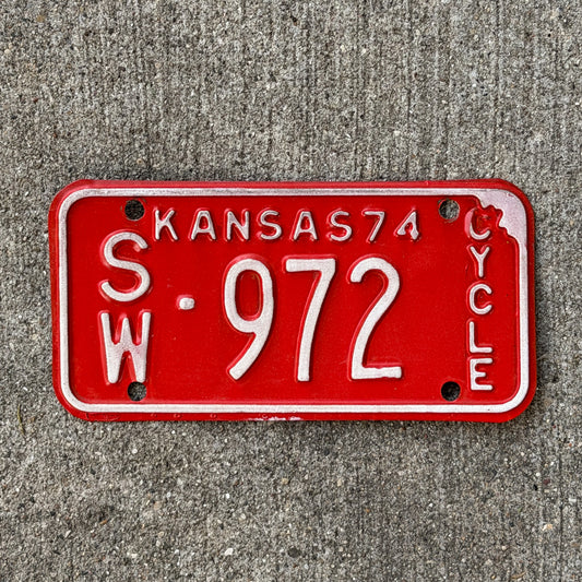 Photo of a 1974 Kansas Motorcycle License Plate Auto Tag Garage Decor Vintage SW 972 with original patina