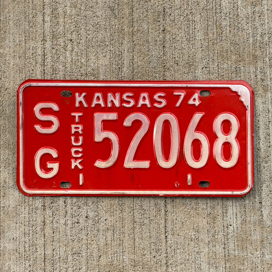 Photo of a 1974 Kansas Truck License Plate Auto Tag Garage Decor Vintage SG 52068 with original patina