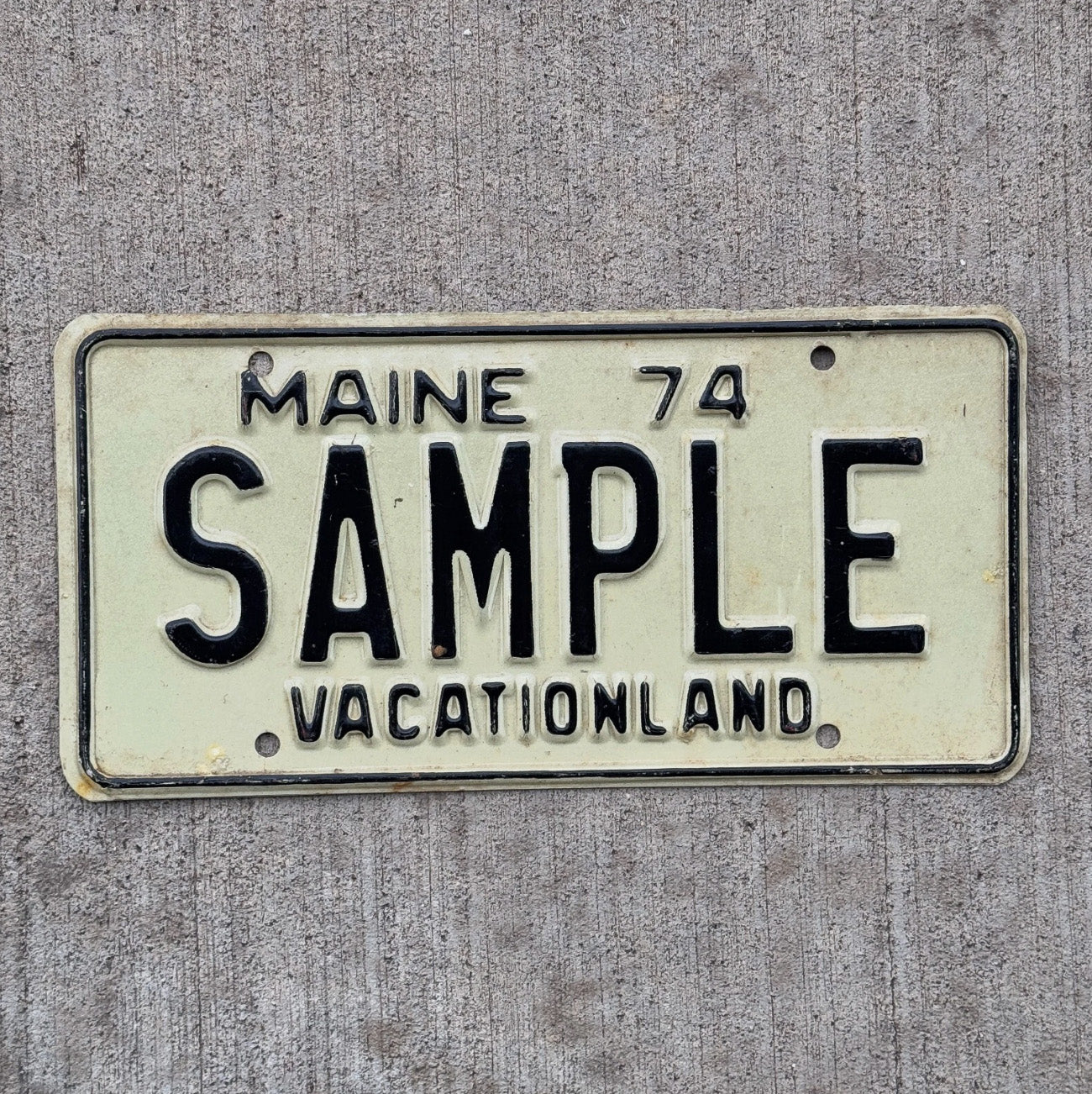 Photo of a 1974 Maine Sample License Plate Auto Tag Garage Decor Vintage Oddball SAMPLE