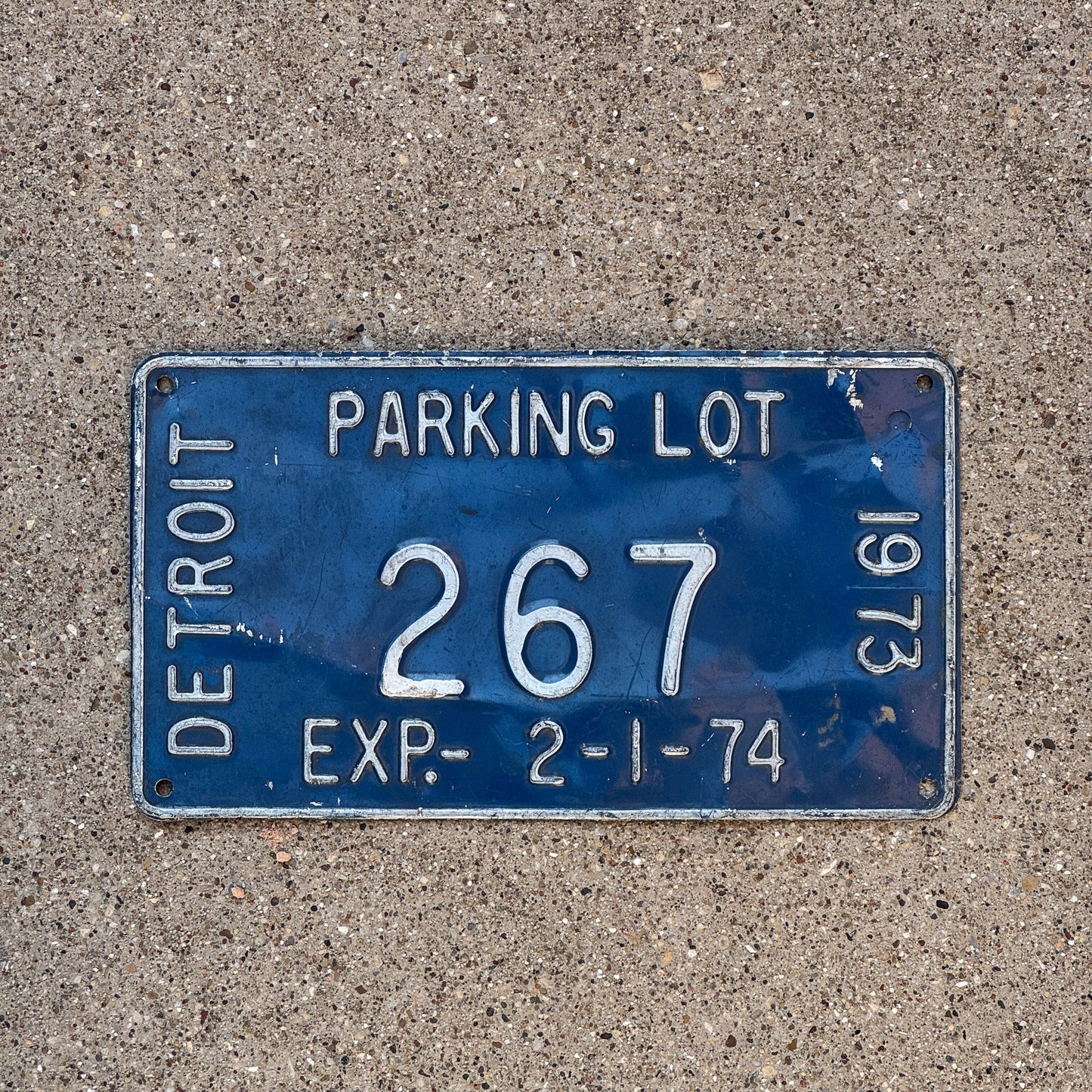 Photo of a 1974 Michigan Detroit Parking Lot License Plate Auto Tag Garage Decor Vintage 267
