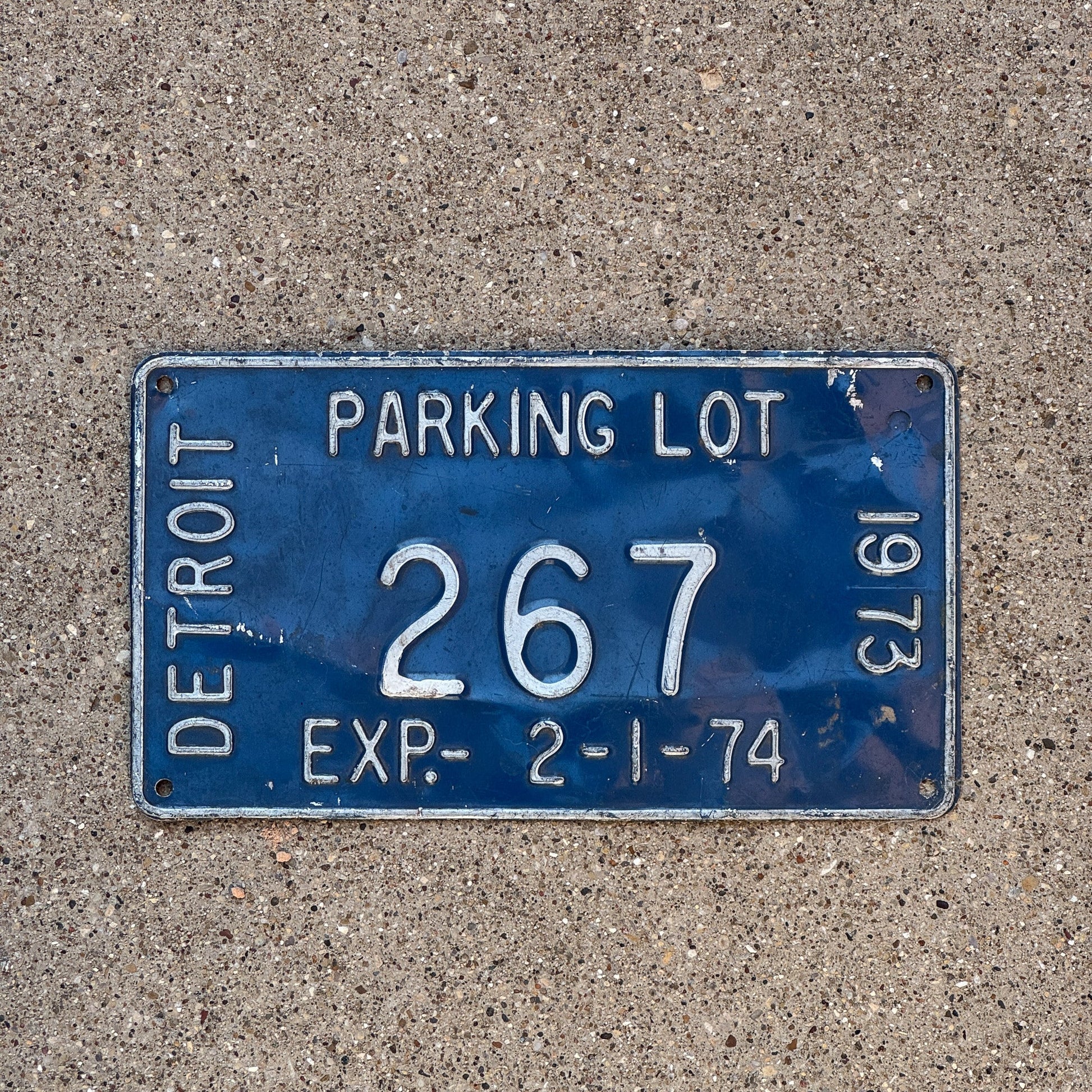 Photo of a 1974 Michigan Detroit Parking Lot License Plate Auto Tag Garage Decor Vintage 267