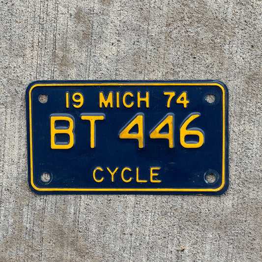 Photo of a 1974 Michigan Motorcycle License Plate Auto Tag Garage Decor Vintage BT 446 with original patina