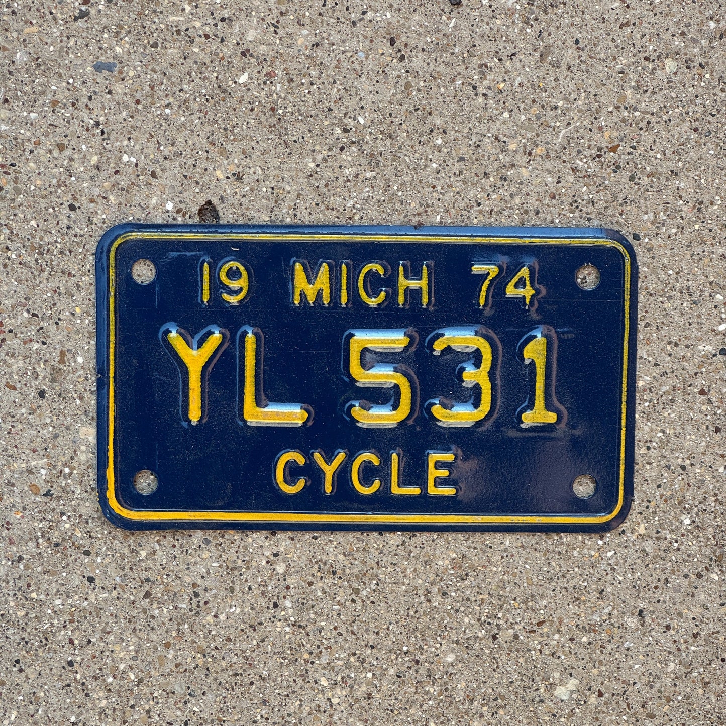 Photo of a 1974 Michigan Motorcycle License Plate Auto Tag Garage Decor Vintage YL 531