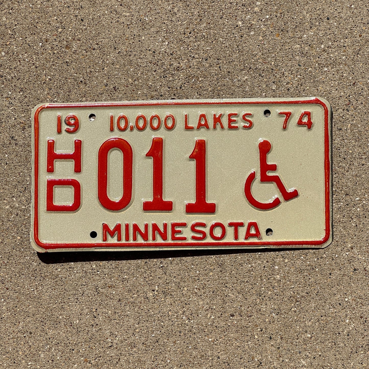 Photo of a 1974 Minnesota Handicapped License Plate Auto Tag Garage Decor Vintage Low Number Two Digit HD 011