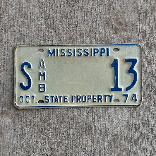 Photo of a 1974 Mississippi State Ambulance License Plate Auto Tag Garage Decor Vintage Lucky Number S 13 with original patina