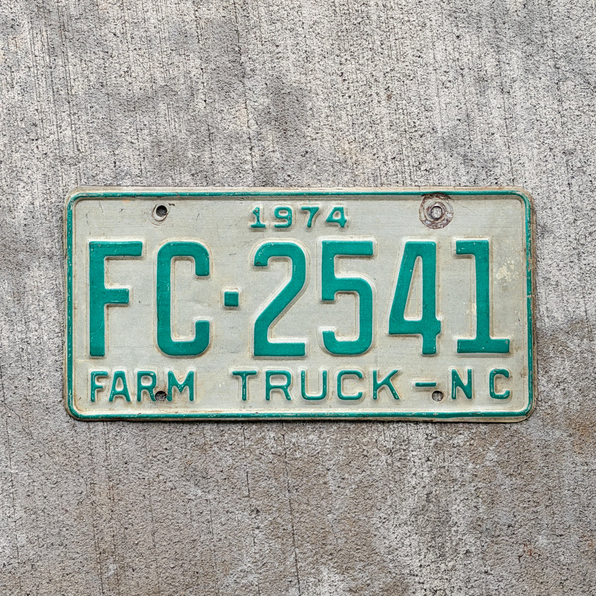 Photo of a 1974 North Carolina Farm Truck License Plate Auto Tag Garage Decor Vintage FC 2541 with original patina