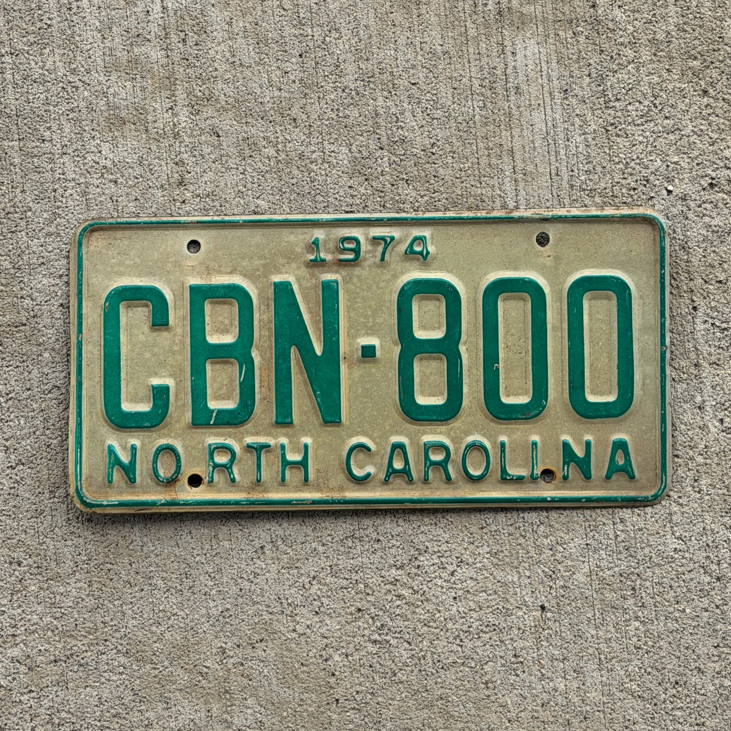 Photo of a 1974 North Carolina License Plate Auto Tag Garage Decor Vintage CBN 800 with original patina