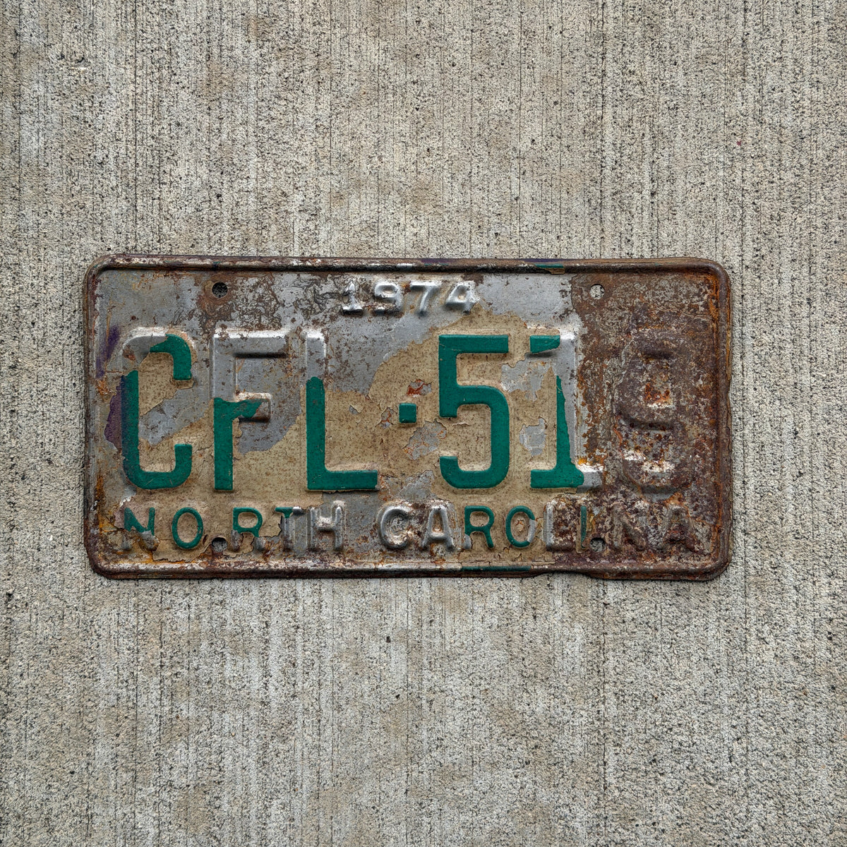 Photo of a 1974 North Carolina License Plate Auto Tag Garage Decor Vintage CFL 519 with original patina