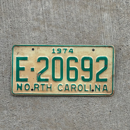 Photo of a 1974 North Carolina Trailer License Plate Auto Tag Garage Decor Vintage Private Trailer E 20692 with original patina