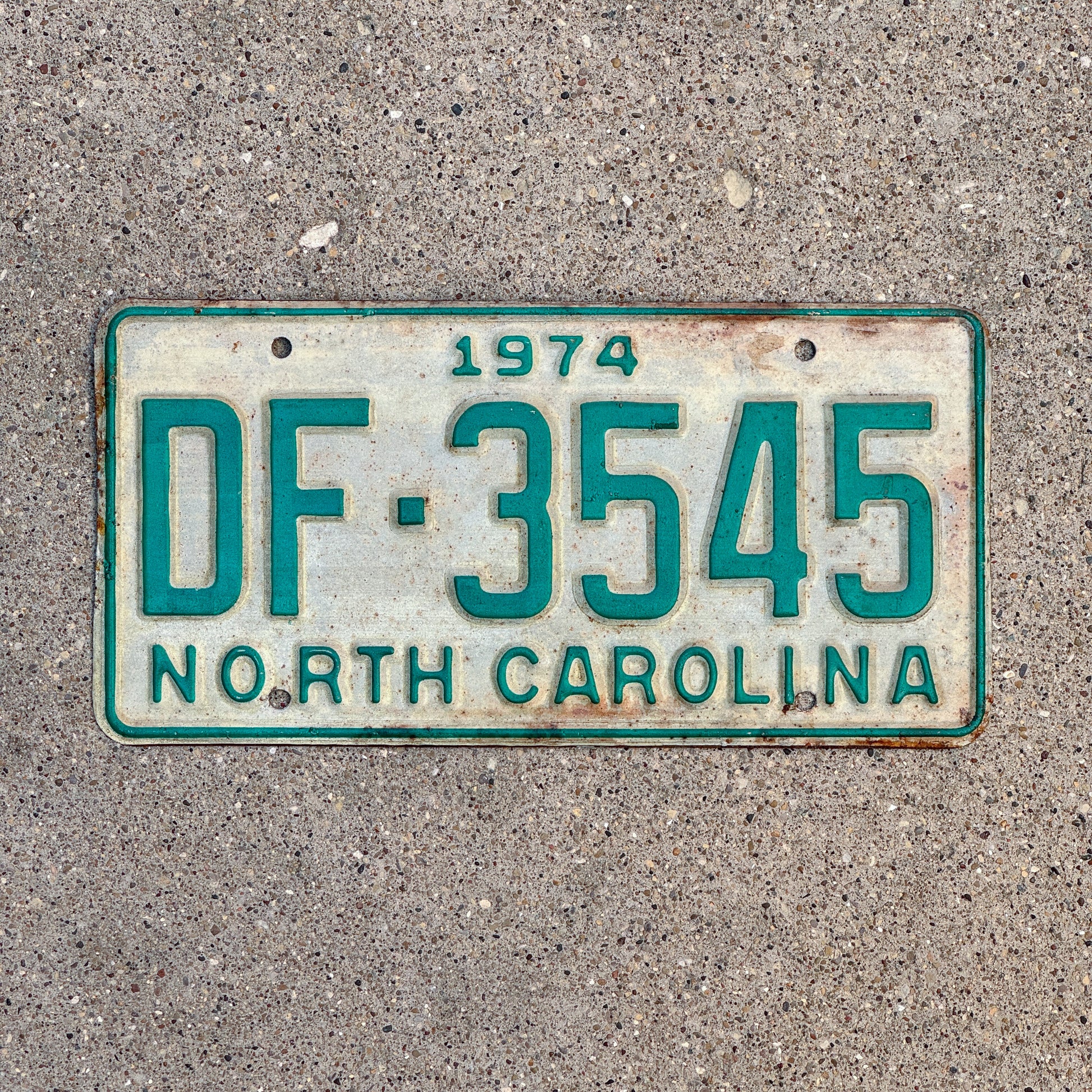Photo of a 1974 North Carolina Truck License Plate Auto Tag Garage Decor Vintage DF 3545 with original patina