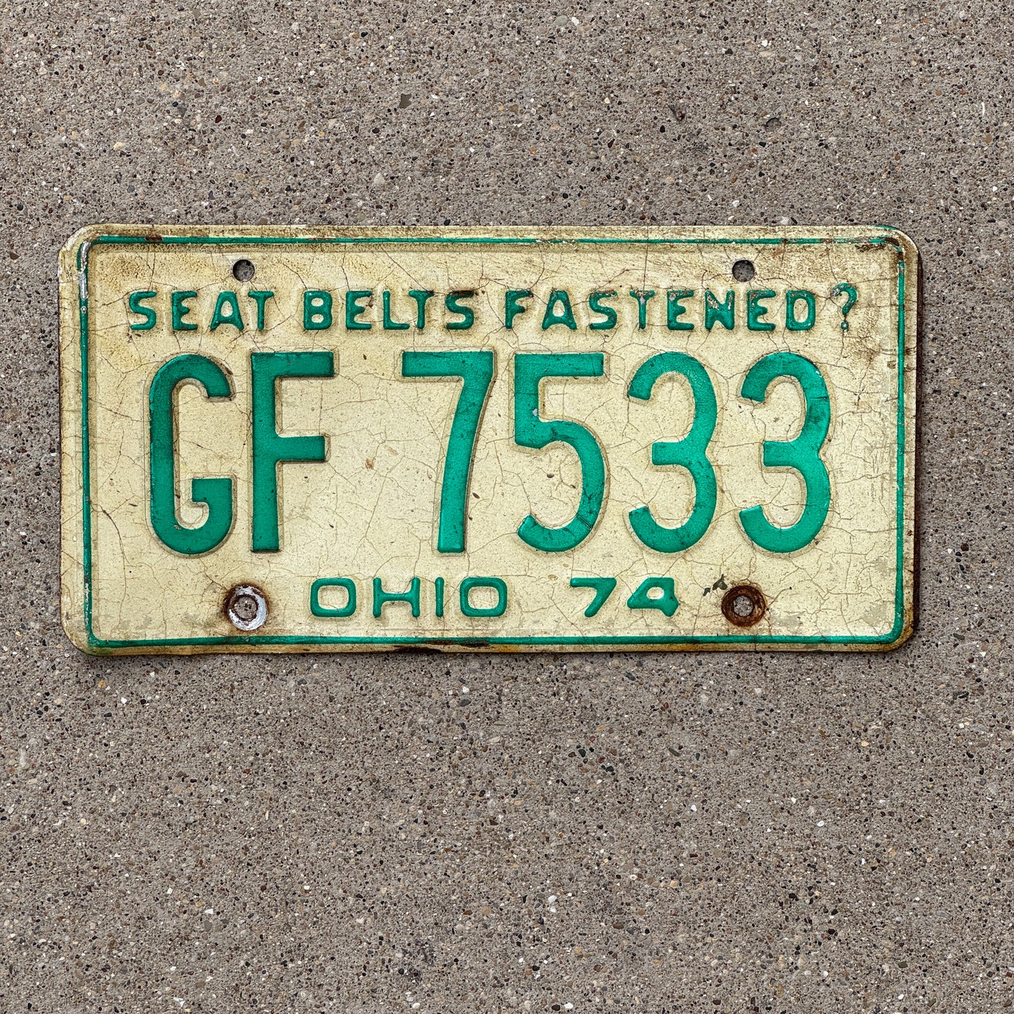 Photo of a 1974 Ohio License Plate Auto Tag 1 Vintage Garage GF 7533 with original patina