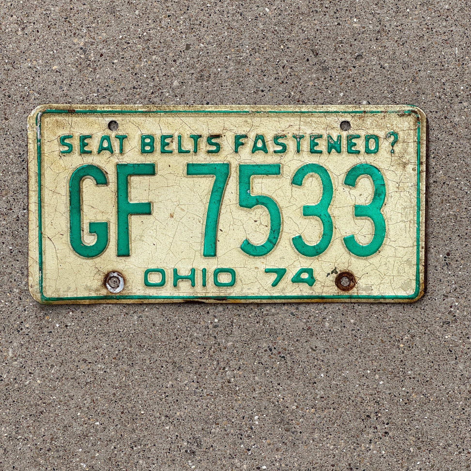 Photo of a 1974 Ohio License Plate Auto Tag 1 Vintage Garage GF 7533 with original patina