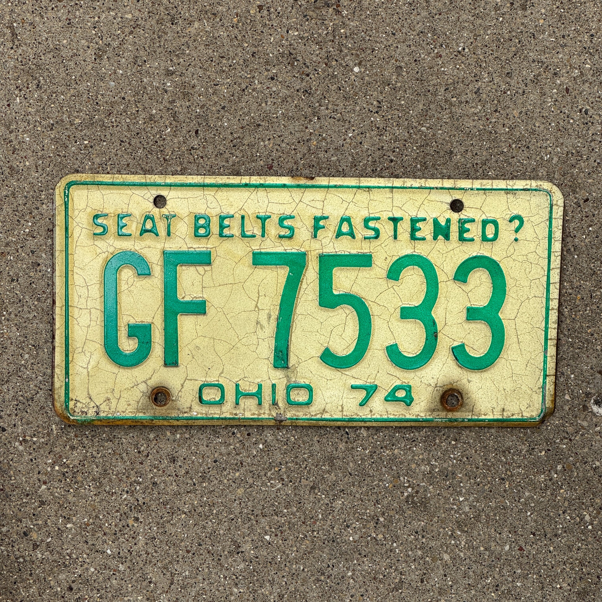 Photo of a 1974 Ohio License Plate Auto Tag 2 Vintage Garage GF 7533 with original patina