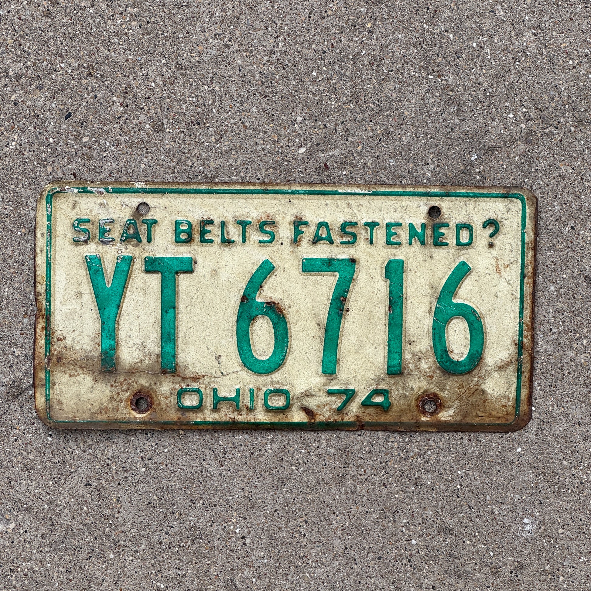 Photo of a 1974 Ohio License Plate Auto Tag Garage Decor Vintage YT 6716 with original patina