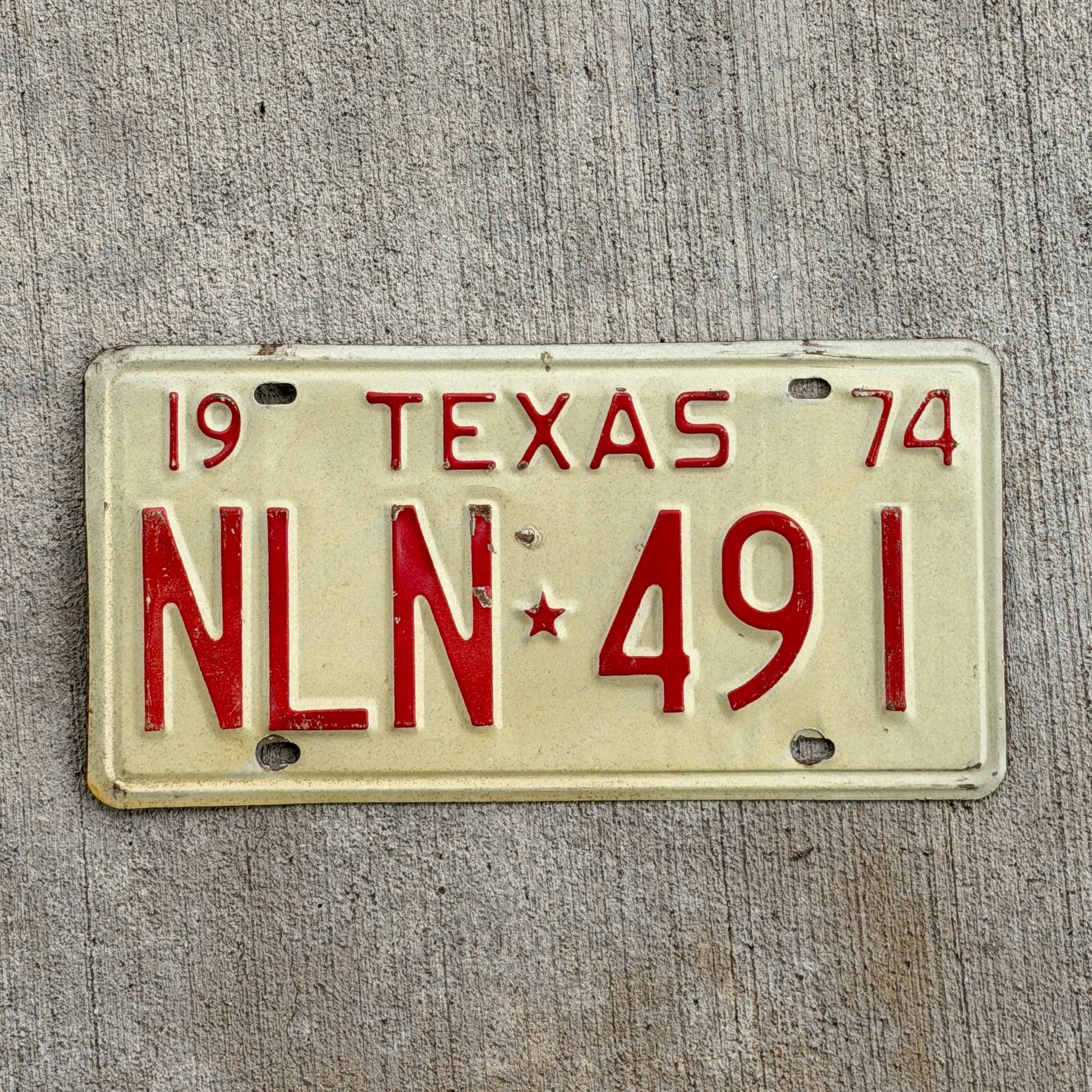 Photo of a 1974 Texas License Plate Auto Tag Garage Decor Vintage NLN 491 with original patina