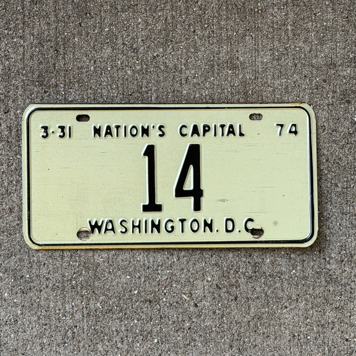 Photo of a 1974 Washington DC License Plate Auto Tag Garage Decor Vintage Low Number Two Digit 14 with original patina