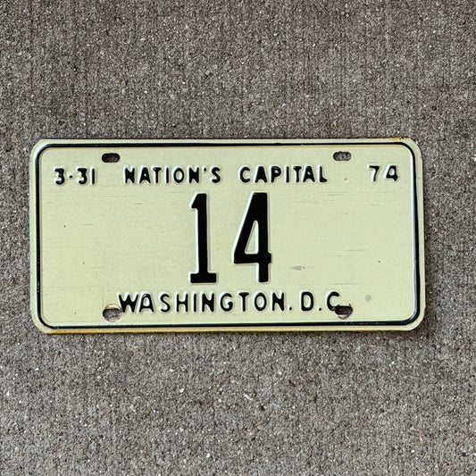 Photo of a 1974 Washington DC License Plate Auto Tag Garage Decor Vintage Low Number Two Digit 14 with original patina