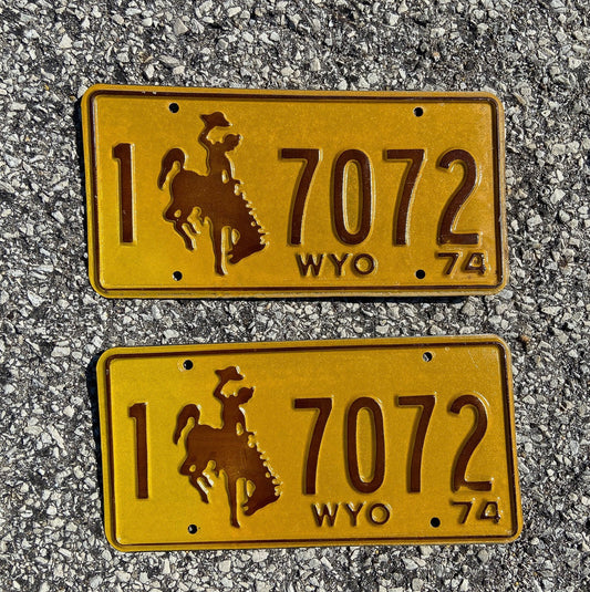 Photo of a 1974 Wyoming License Plate Pair Auto Tag Garage Decor Vintage Cowboy Rodeo 1 7072 with original patina