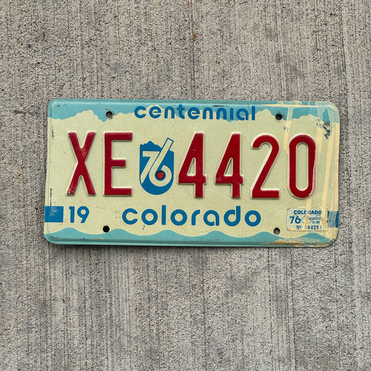 Photo of a 1975 1976 Colorado License Plate Auto Tag 1 Vintage Garage Bicentennial 420 Weed Smoke XE 4420 with original patina
