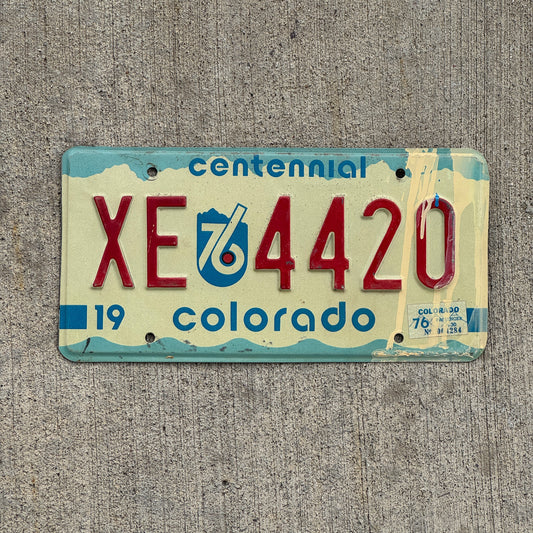 Photo of a 1975 1976 Colorado License Plate Auto Tag 2 Vintage Garage Bicentennial 420 Weed Smoke XE 4420 with original patina