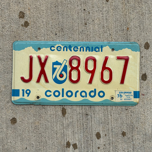 Photo of a 1975 1976 Colorado License Plate Auto Tag Garage Decor Vintage Bicentennial JX 8967 with original patina
