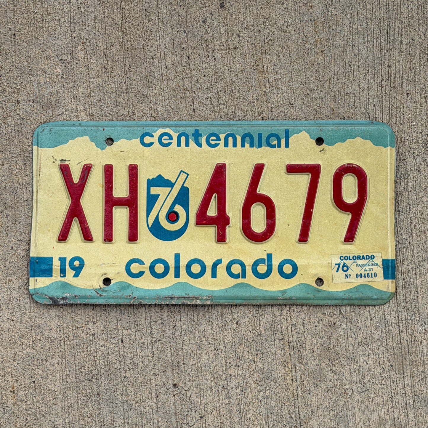 Photo of a 1975 1976 Colorado License Plate Auto Tag Garage Decor Vintage Bicentennial XH 4679 with original patina