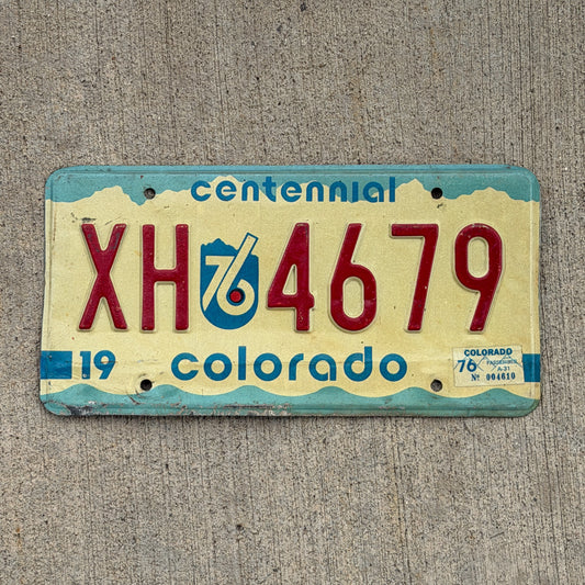 Photo of a 1975 1976 Colorado License Plate Auto Tag Garage Decor Vintage Bicentennial XH 4679 with original patina