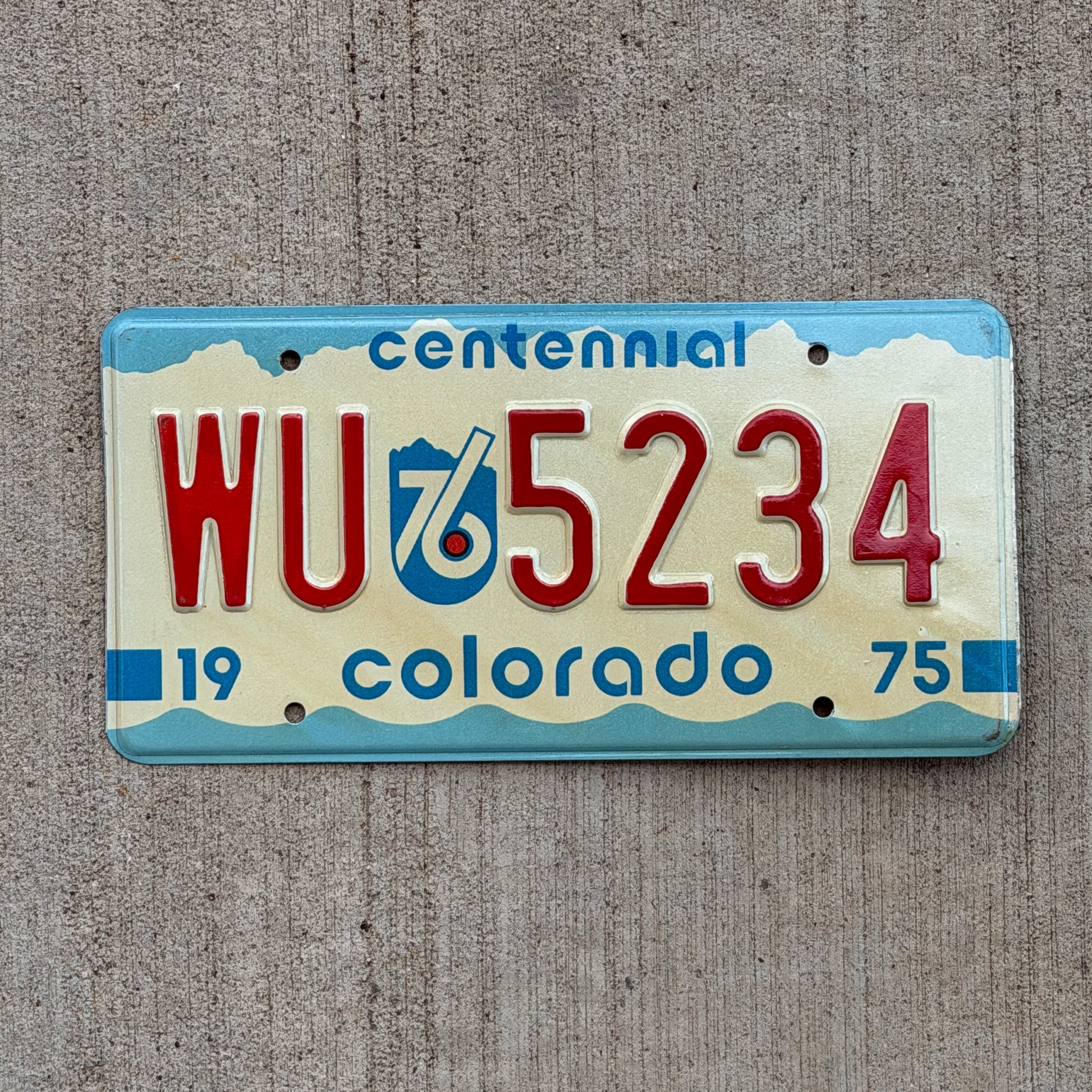 Photo of a 1975 1976 Colorado License Plate Auto Tag Garage Decor Vintage WU 5234 with original patina