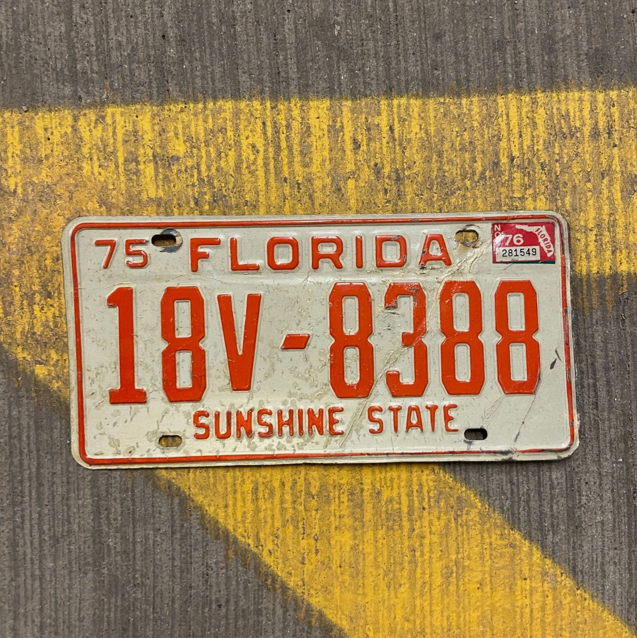 Photo of a 1975 1976 Florida Trailer License Plate Auto Tag Garage Decor Vintage 18 V 8388 with original patina