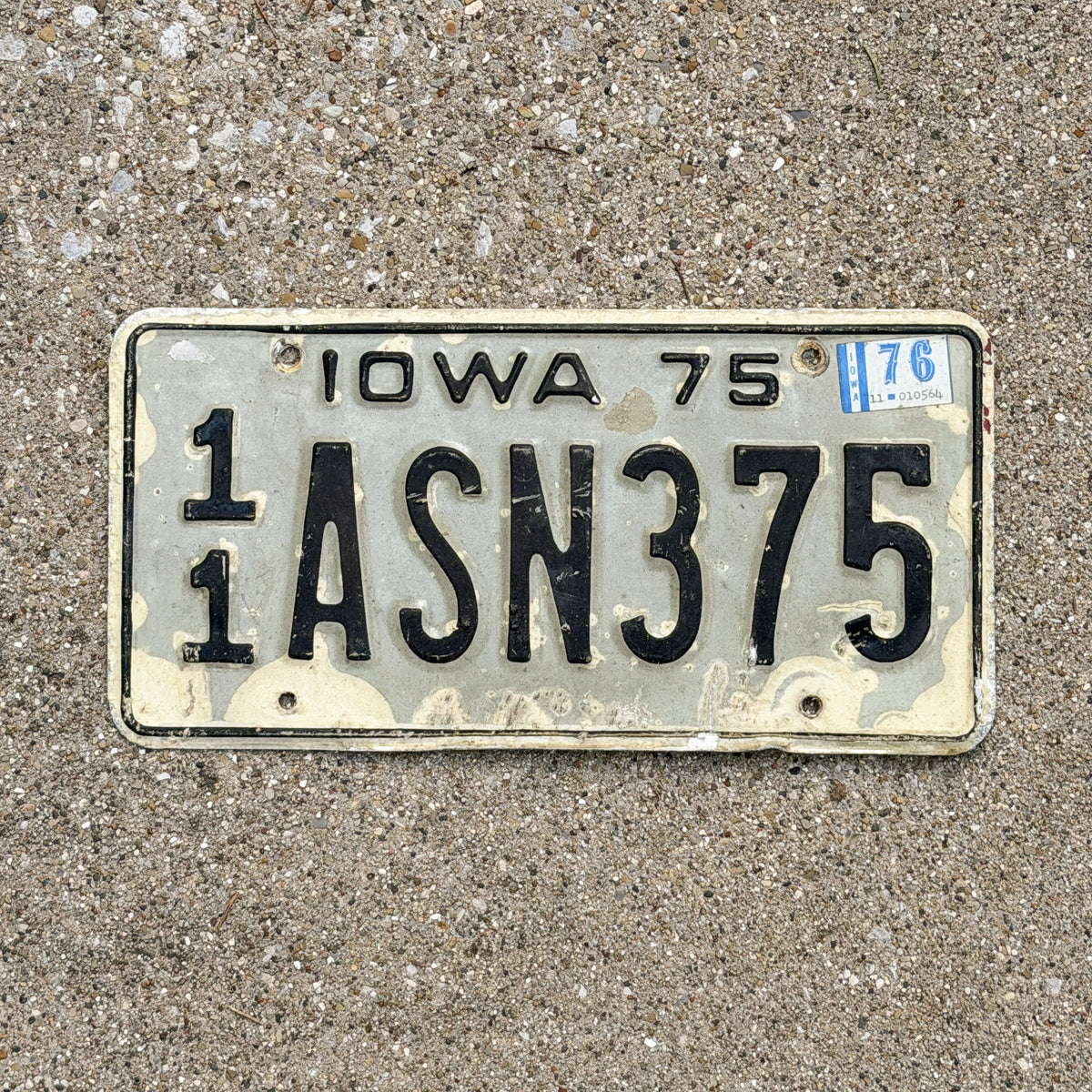 Photo of a 1975 1976 Iowa License Plate Auto Tag Garage Decor Vintage 11 ASN 375 with original patina