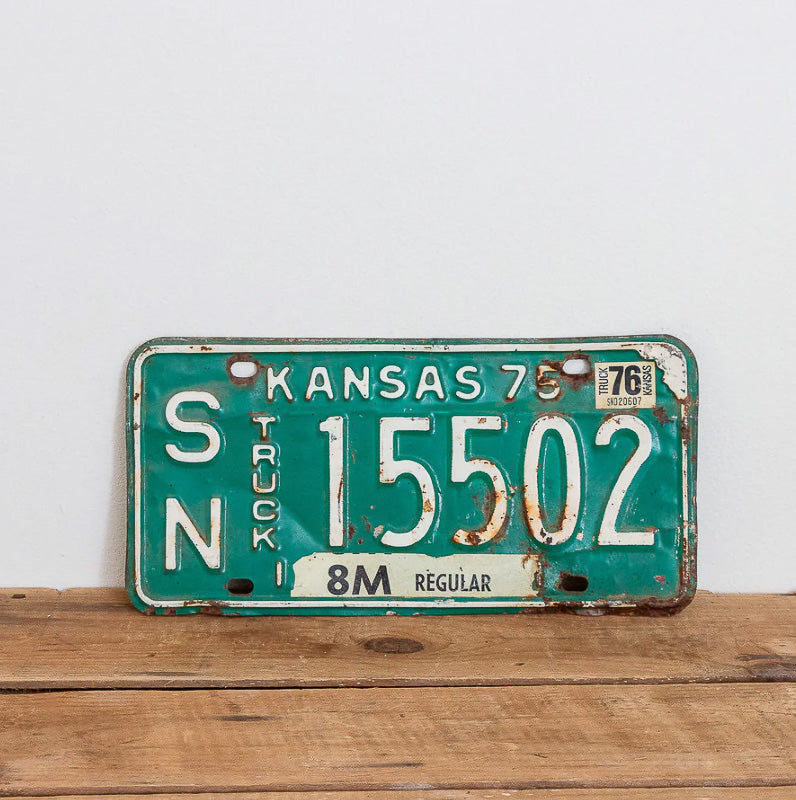 Photo of a 1975 1976 Kansas Truck Auto Tag Garage Decor Vintage SN 15502 with original patina