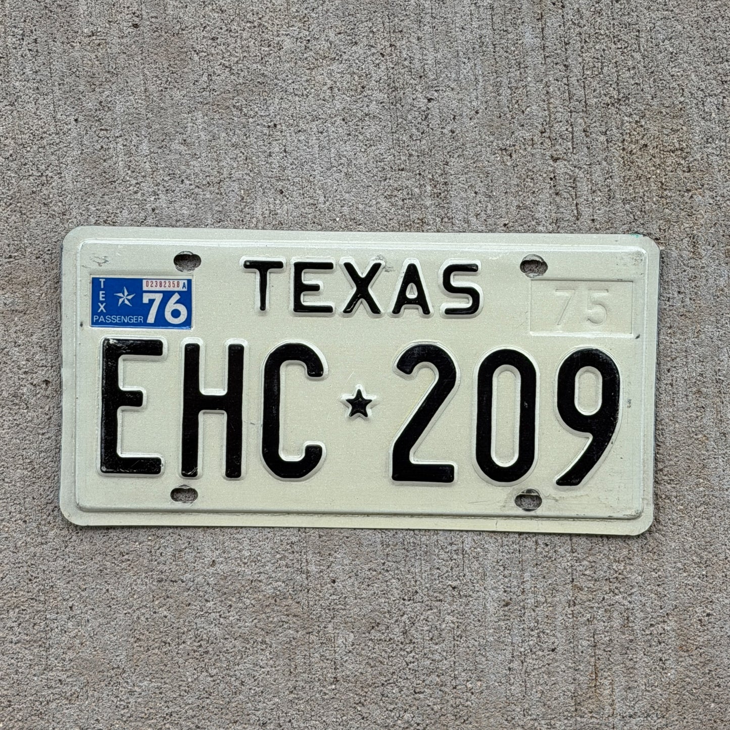 Photo of a 1975 1976 Texas License Plate Auto Tag Garage Decor Vintage EHC 209 with original patina