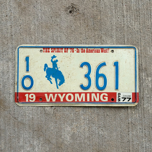 Photo of a 1975 1977 Wyoming License Plate Auto Tag Garage Decor Vintage Bicentennial Cowboy Rodeo 10 361 with original patina