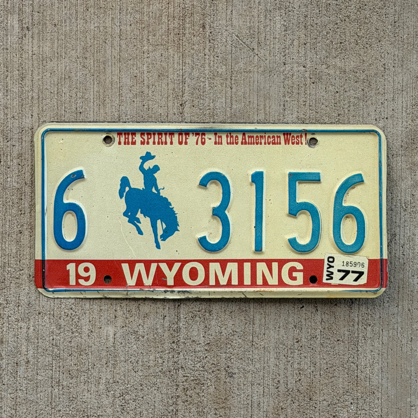 Photo of a 1975 1977 Wyoming License Plate Auto Tag Garage Decor Vintage Bicentennial Cowboy Rodeo 6 3156 with original patina