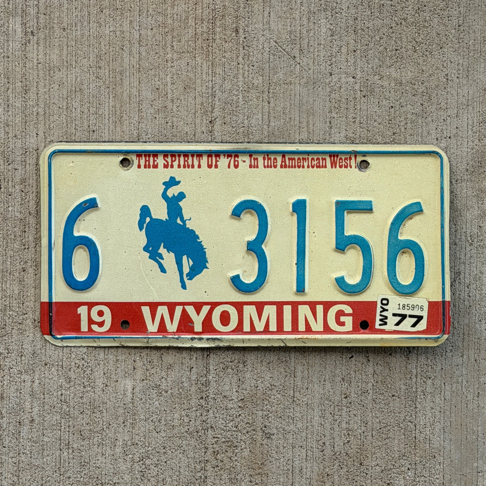 Photo of a 1975 1977 Wyoming License Plate Auto Tag Garage Decor Vintage Bicentennial Cowboy Rodeo 6 3156 with original patina
