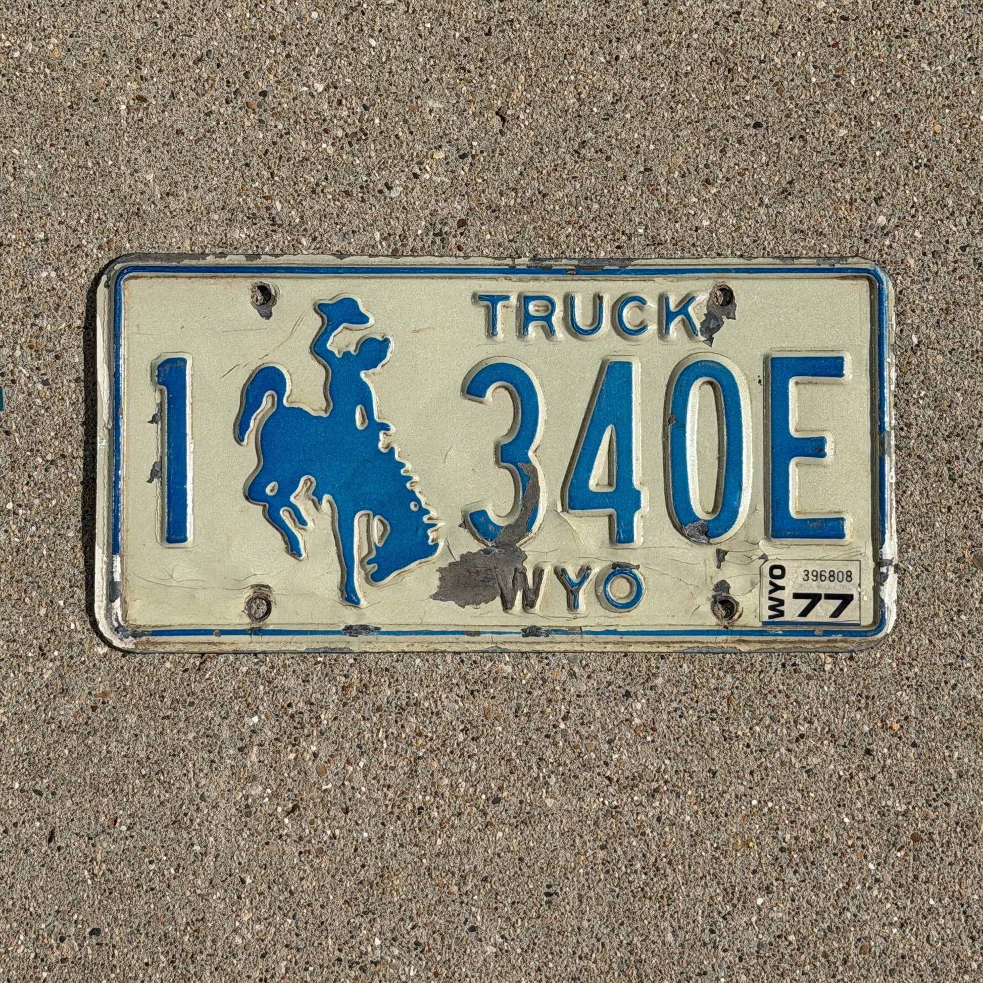 Photo of a 1975 1977 Wyoming Truck License Plate Auto Tag Garage Decor Vintage Cowboy Rodeo 1 340 E with original patina